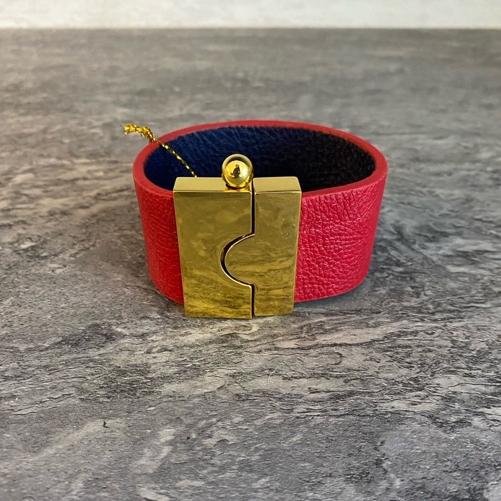 Never been worn with tags blue and red cuff
